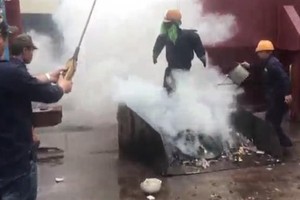 Testing new firefighting liquid. (Photo courtesy of Dr Doan Ha Thang)