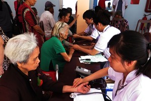 Senior citizens receive health checks in District 8, HCM City. (Photo: VNA/VNS)