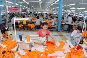 Suit making for export at Nha Be Garment Company (Photo: SGGP)