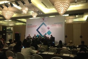 Experts discuss industrial investment through M&A activities in Hanoi yesterday. (Photo: VNA/VNS)