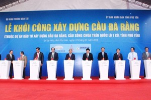 Prime Minister Nguyen Xuan Phuc attends the ground breaking ceremony of Da Rang bridge, one of the longest bridges in the central region of Vietnam