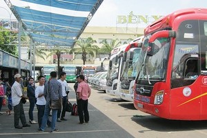 Passengers at a coach station in HCMC