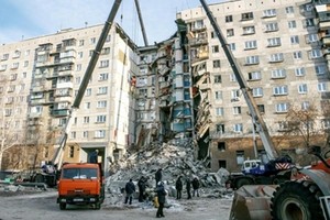 The rubble of the partially collapsed apartment building