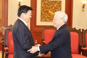  General Secretary of the Communist Party cum President of Vietnam Nguyen Phu Trong receives Prime Minister Thongloun Sisoulith