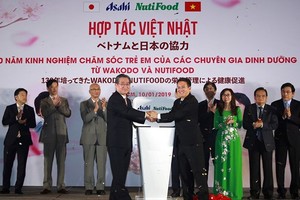 Nutifood and Japanese beverage producer Asahi set joint venture to produce nutritional products for Vietnamese children. (Photo: SGGP)
