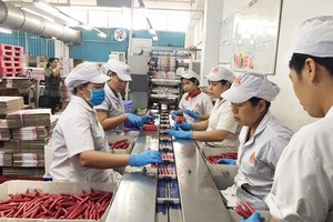 The sausage production line at Vissan Company (Photo: SGGP)