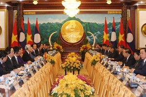 At the talks between General Secretary of the Communist Party of Vietnam Central Committee and President Nguyen Phu Trong and his Lao counterpart Bounnhang Vorachith in Vientiane on February 24 (Photo: VNA)