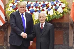 General Secretary of the Communist Party of Vietnam Central Committee and President Nguyen Phu Trong (right) and US President Donald Trump (Photo: SGGP)