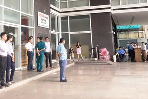 Representatives of some garment and textile firms wait for leaders of Central Group Vietnam at the group’s headquarters in HCMC on July 3 (Photo: SGGP)