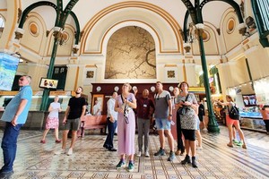Foreign visitors admiring a period attraction