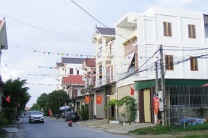 Village people can finally afford decent houses thanks to their family members working abroad (photo taken at Dien Thap Commune, Nghe An Province)