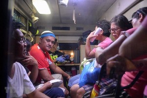 Hundreds of people have been taken to hospital after drinking the coconut wine. (Photo: AFP/VNA)