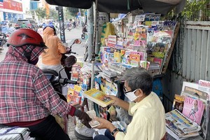 An old news-stand on the side of the road