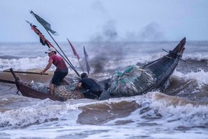 Two squid fishing boats sink, one dead, 79 rescued, 13 missing