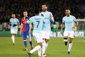 Ilkay Gundogan (giữa) mừng bàn thắng vào lưới Basel ở lượt đi vòng 1/8. Ảnh: Getty Images