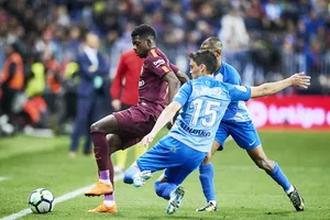 Dembele (nâu) đã có màn trình diễn xuất sắc trước Malaga.Ảnh: Getty Images.