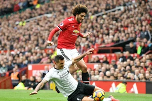 Marouane Fellaini trong lần đối đầu Liverpool hồi tháng 3. Ảnh: Getty Images