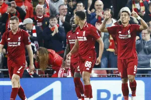 Roberto Firmino (phải) mừng bàn thắng quyết định phút cuối. Ảnh: Getty Images 