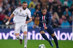 Kylian Mbappe (phải) cùng Paris SG đối đầu Real Madrid ở vòng bảng Champions League. Ảnh: Getty Images