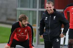 Adam Lallana và HLV Brendan Rodgers hợp tác ngắn ngủi ở Liverpool. Ảnh: Getty Images
