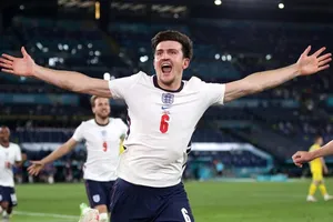 Harry Maguire phấn khích khi ghi bàn trong trận thắng Ukraine 4-0 ở tứ kết. Ảnh: Getty Images