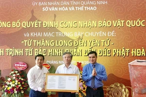 Lễ công bố quyết định công nhận bảo vật Quốc gia. Ảnh: TTXVN