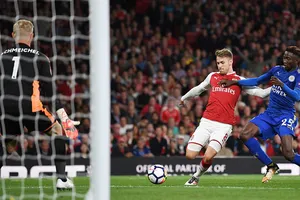 Aaron Ramsey ghi bàn quân bình tỷ số 3 - 3 cho Arsenal. Ảnh: Reuters