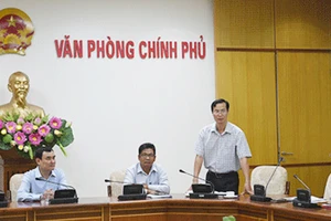 Ông Đỗ Ngọc Huỳnh (đứng) phát biểu trong một buổi lễ năm 2015. Ảnh: VGP