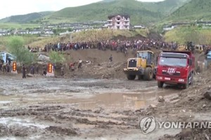 This image captured by footage from North Korea's state TV station on Sept. 16, 2016, shows North Korea's efforts to recover from massive floods that hit the country's northeastern province. (For Use Only in the Republic of Korea. No Redistribution) (Yonh