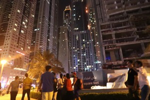 Fire is seen at the 1,105 foot tall Torch tower skyscraper on August 4, 2017 in Dubai. — AFP/VNA Photo 