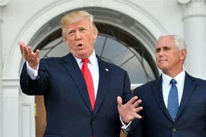 US President Donald Trump, with Vice President Mike Pence to his right, has more tough words for North Korea. — AFP/VNA