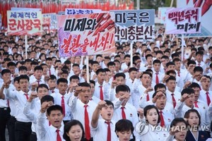 This file photo released by the Korean Central News Agency on Sept. 24, 2017, shows North Koreans holding a mass anti-U.S. rally in Pyongyang on Sept. 23, 2017. (Yonhap)