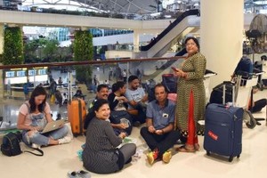 Tourists on Bali Island are stranded at an airport in Denpasar on Monday as their return flights were canceled following a volcanic eruption on the island. — KYODO/VNA Photo