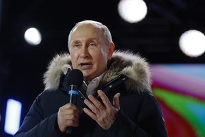 President Vladimir Putin addresses the crowd during a rally and a concert celebrating the fourth anniversary of Russia’s annexation of Crimea at Manezhnaya Square in Moscow on March 18, 2018. — AFP/VNA 
