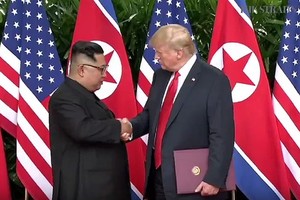 Trump, Kim sign agreementafter historic summit but few specifics