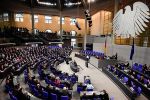 Thủ tướng Đức Angela Merkel và các thành viên nội các tại một phiên họp Quốc hội ở Berlin. Ảnh tư liệu: AFP/TTXVN