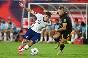 Nếu thắng tuyển Mỹ, Canada (phải) sẽ bỏ túi suất dự World Cup đầu tiên sau 36 năm