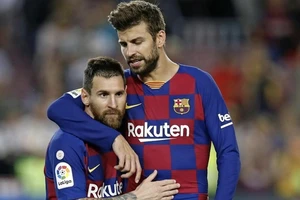 Gerard Pique và Leo Messi