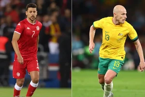 Youssef Msakni (Tunisia) và Aaron Mooy (Australia)