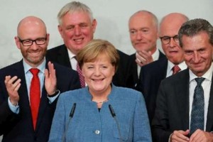 默克爾是一位靦腆的東德妹。