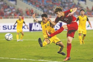 越南隊(紅衣)６比０大勝汶萊隊。