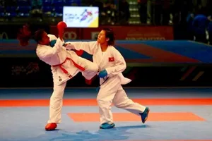 Nguyễn Thị Ngoan (đai xanh) đã làm nên lịch sử với HCV tại một giải thuộc hệ thống K1. Nguồn: W.K.F