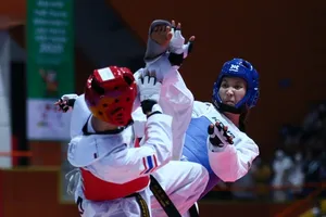 Trương Thị Kim Tuyền (xanh) vẫn là gương mặt quan trọng nhất của taekwondo nữ Việt Nam. Ảnh: DŨNG PHƯƠNG