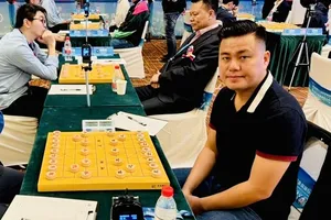 Kỳ thủ Lại Lý Huynh đang có cơ hội vào trận chung kết nội dung cá nhân khi vẫn đứng trong nhóm đầu sau 7 vòng đấu. Ảnh: VXF