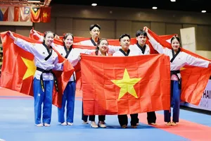 Võ sĩ taekwondo Việt Nam giành HCV bài biểu diễn đồng đội quyền sáng tạo nam nữ. Ảnh: DP