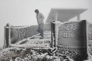 Summit of Mau Son blanketed in white frost