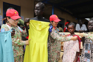 Resilient Vietnamese roses in harsh sun and wind of Africa