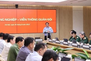 Prime Minister Pham Minh Chinh speaks at the working session with leaders of Viettel. (Photo: VNA)