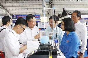 Visitors are looking at displays at the 13th Creative Youth Festival 2022