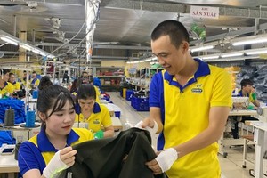 Workers in Dony Garment Co. Ltd (sited in Binh Chanh District) are checking their products